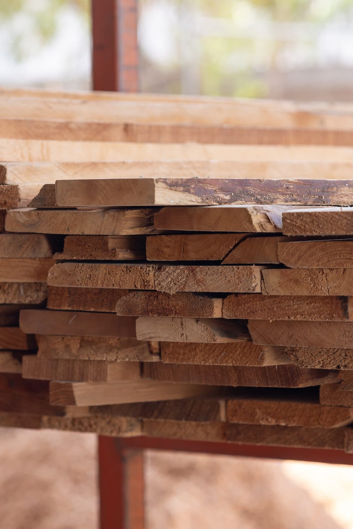 Selected solid-wood boards stacked in the workshop